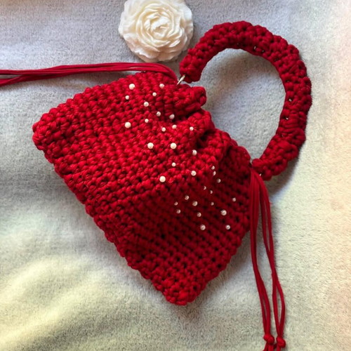 Handmade red drawstring bag with pearls