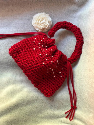 Handmade red drawstring bag with pearls