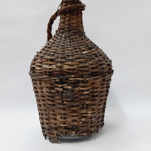 Dame-Jeanne vintage demijohn bottle used, glass with wicker