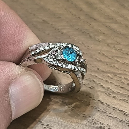 Silver vintage ring with blue zircon and white stones