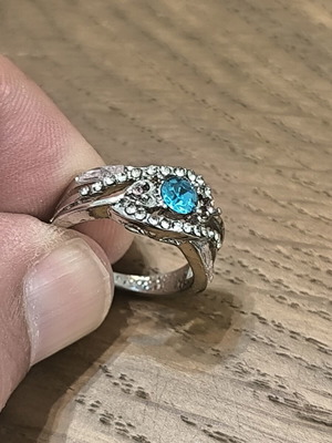 Silver vintage ring with blue zircon and white stones
