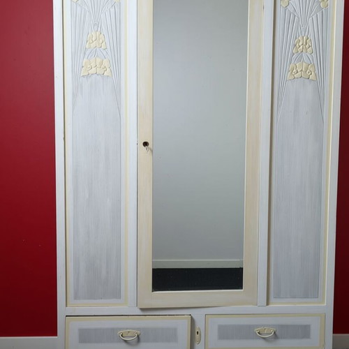 Vintage three-door wardrobe with mirror and floral carvings, used