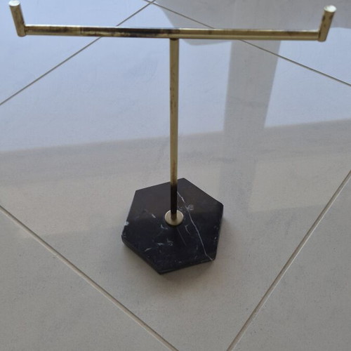 Jewelry stand used with black hexagonal marble base