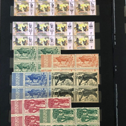Stamp album with large collection of mint and used blocks worldwide