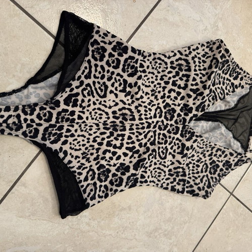 Animal print one-piece swimsuit with black mesh details