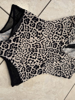 Animal print one-piece swimsuit with black mesh details