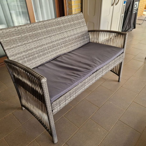 Garden sofa set with cushions and table