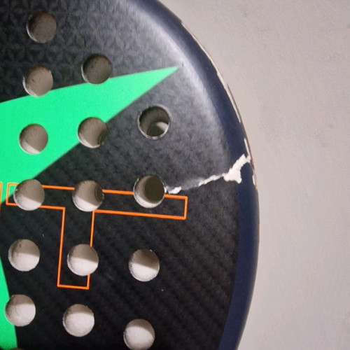 Padel racket used, moderate condition with small cracks