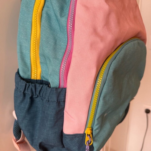 Children's school backpack used with multiple compartments and supportive back