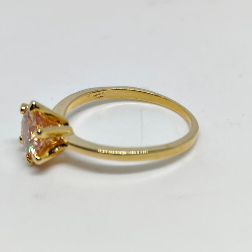 Ring with yellow gold finish and champagne stone, like new