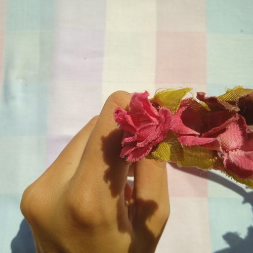 Children's tiara used with pink and green roses