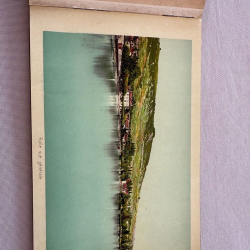 Leather-bound book with used Swiss Geneva postcard images