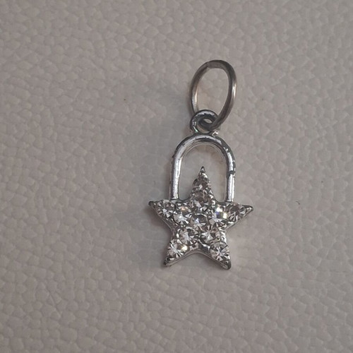 Charm star decorated with sparkling stones used, silver
