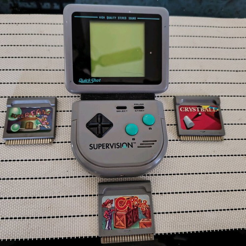 Watara Supervision console used with 3 games
