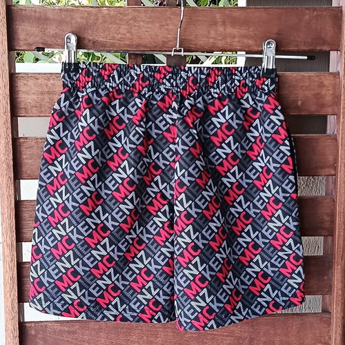 McKenzie Shorts Swimwear new, black with red print, size 12-13 years