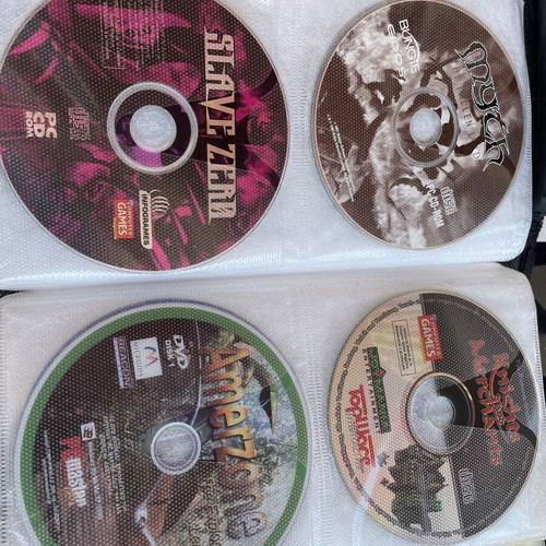 Vintage PC and PlayStation 2 gaming bundle with case, 70 CDs/DVDs