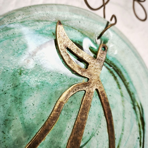 Glass and bronze wall decoration with sailboat