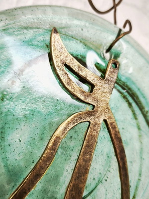 Glass and bronze wall decoration with sailboat