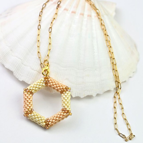 Delicate beige necklace with hexagonal pendant custom made