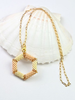 Delicate beige necklace with hexagonal pendant custom made