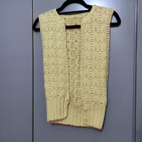 Sleeveless knitted vest used with pattern yellow pale