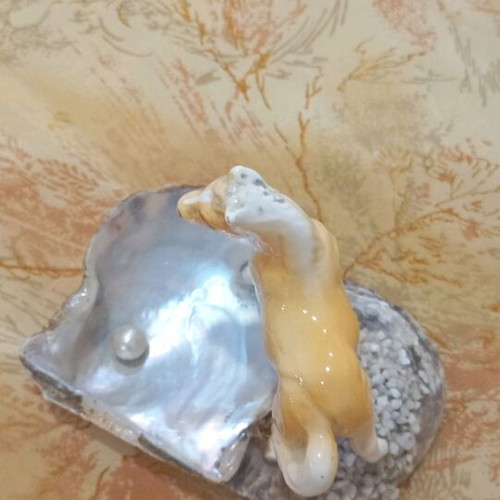 Decorative shell used with ceramic horse
