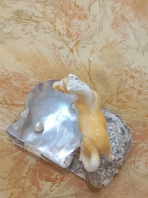 Decorative shell used with ceramic horse