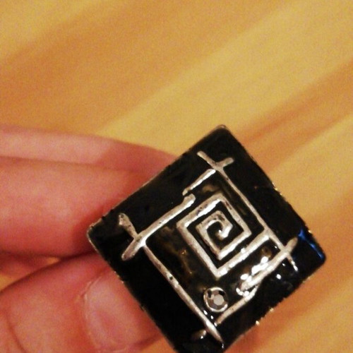 Square statement ring used with black enamel and silver geometric design