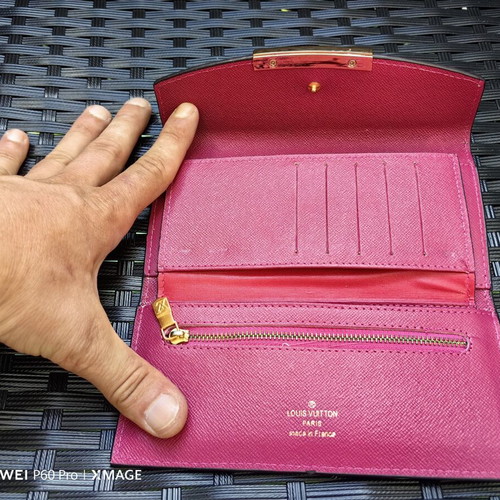 Louis Vuitton wallet used, authentic with visible marks inside
