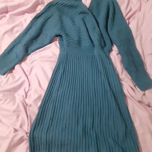 Knitted blue dress new with perforated sleeve designs and back opening size M