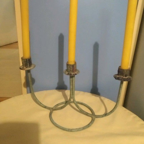 Vintage three-arm candlestick made of patinated brass like new