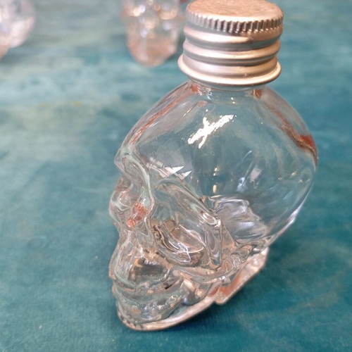 Decorative skulls and miniature bottles unused, set of 6+5 with large jar