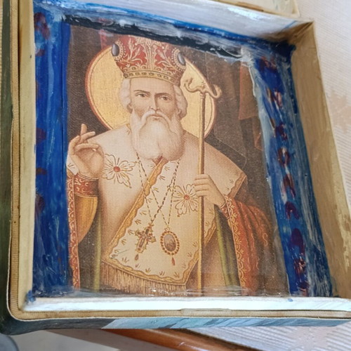 Cardboard box with silk-screened religious icon on canvas