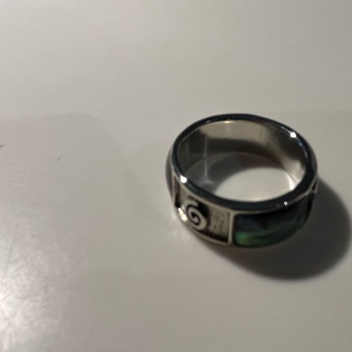 Steel ring with inlaid abalone shell details