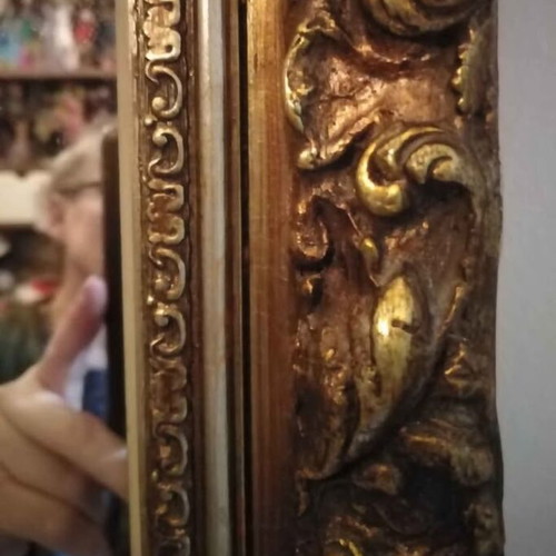 Antique mirror used with carved frame in gold crackle finish