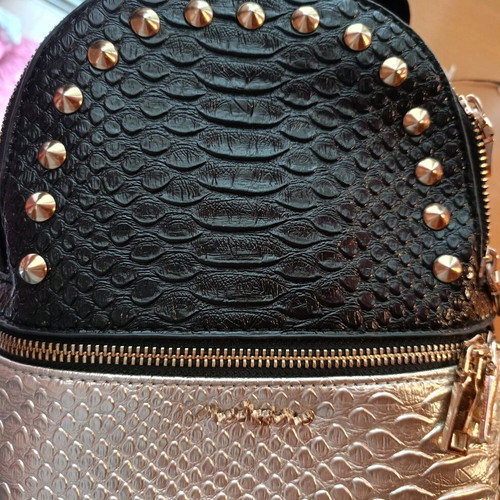 Small backpack like new, black and gold