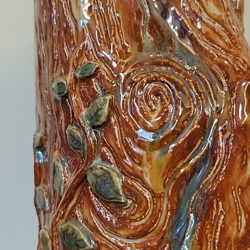 Handmade ceramic vase with natural decorative elements