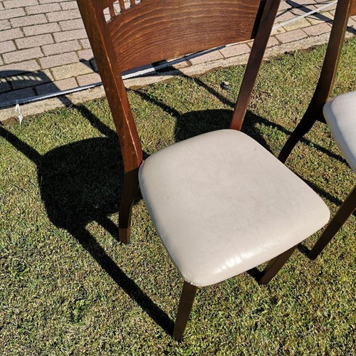 Wooden chair used with beige leather seat dark brown