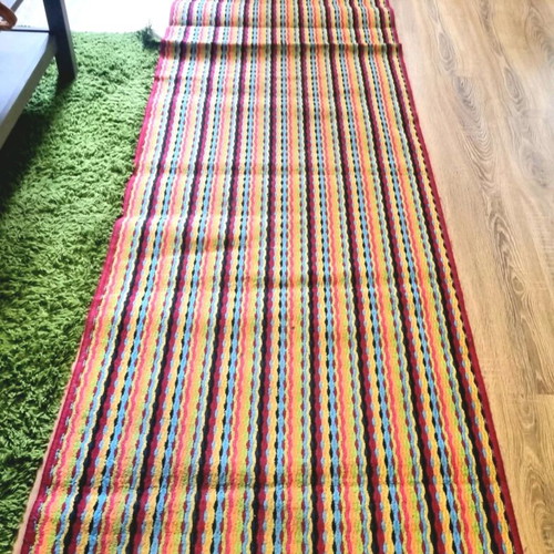 Runner rug used with stripes in bright colors