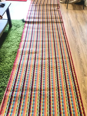 Runner rug used with stripes in bright colors