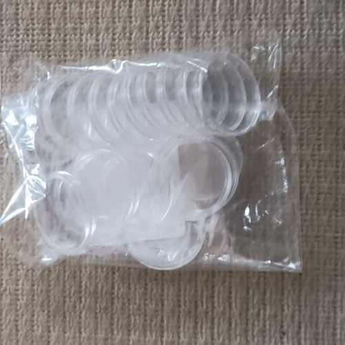 Coin holders new, 20 plastic with 4 cm radius and 9 with 2 cm radius