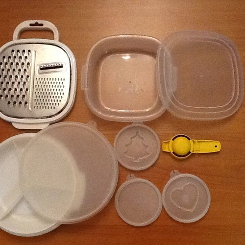 Set of three kitchen containers and stainless steel grater