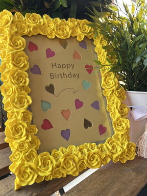 Handmade yellow floral photo frame used, synthetic material and plaster