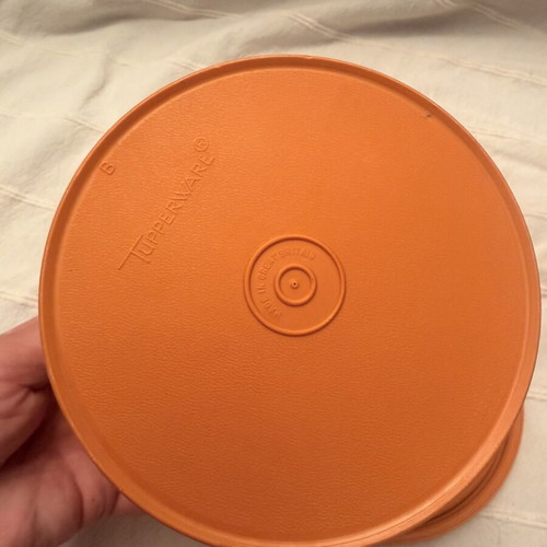 Tupperwear vintage deep circle orange container with lid used