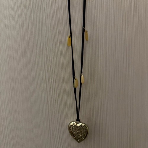 Long heart necklace with black cord like new, gold color