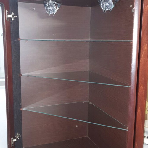 Corner showcase furniture like new with 3 shelves, 2 doors and spotlights