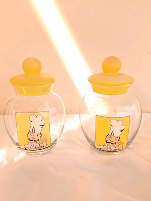 Set of 2 yellow glass jars used for kitchen