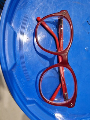 Glasses used with thick lenses and some whitening on the frame