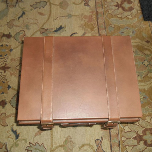 Leather folding table used with suitcase-shaped storage space