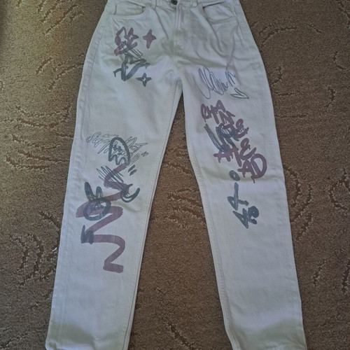 Modern girls' jeans with colorful graffiti